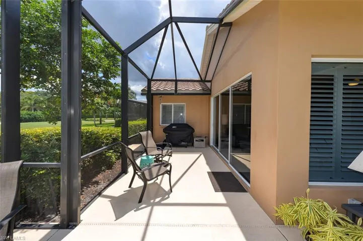 Sunroom featuring vaulted ceiling