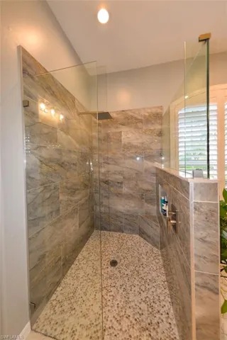 Bathroom featuring walk in shower
