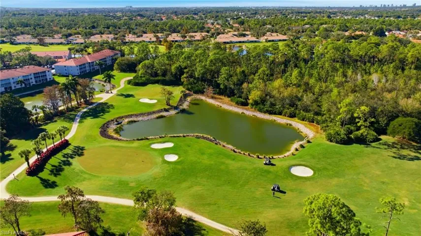 Drone / aerial view of a local golf course and a large body of water