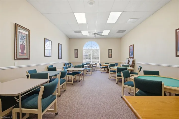 Office featuring a drop ceiling and ceiling fan