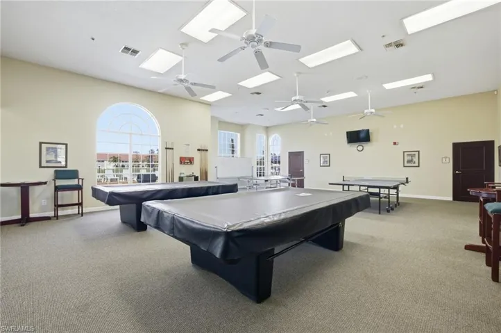 Playroom featuring pool table, a ceiling fan, and a skylight