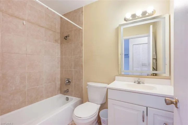 Bathroom featuring bathtub / shower combination and vanity