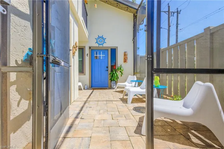 Enter through a large screened-in, gated lanai. (Unfurnished)