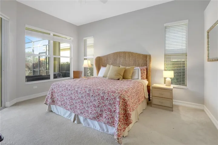 Carpeted bedroom with ceiling fan