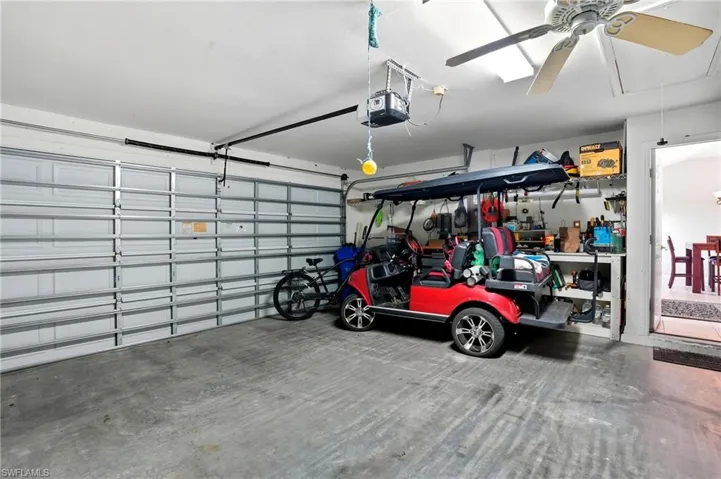 2 Car Garage with ceiling fan and a garage door opener