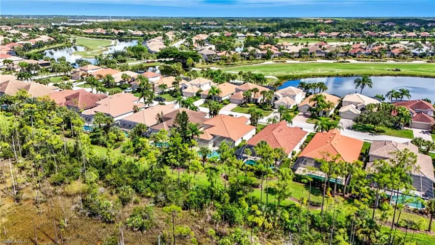 Aerial perspective of suburban area with a large body of water