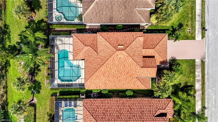 Drone / aerial view of house and pool
