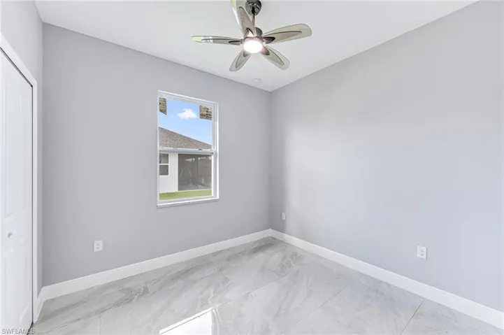 Spare room with ceiling fan