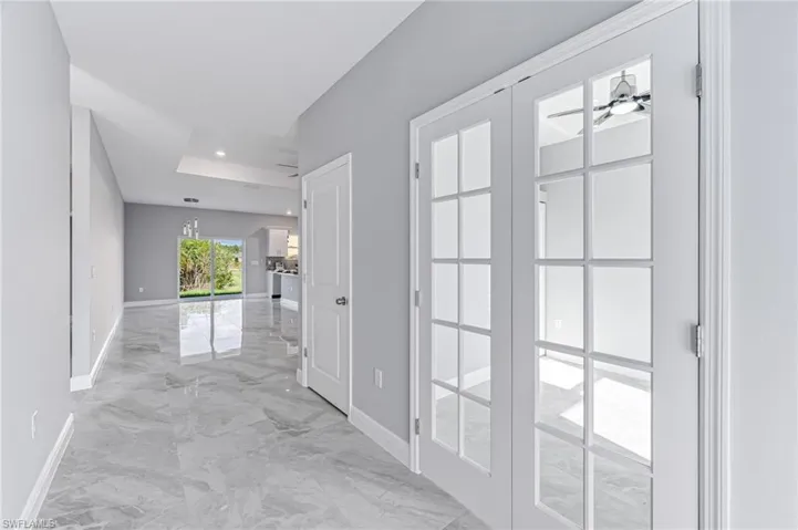 Hallway featuring french doors