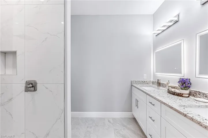 Bathroom featuring vanity and walk in shower