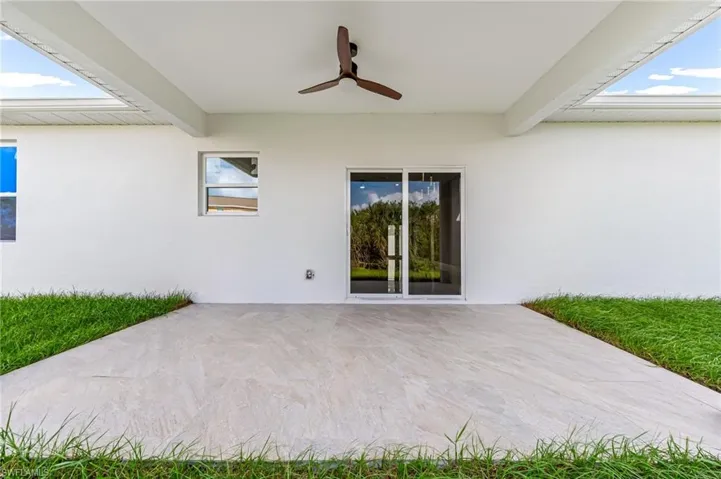 View of patio featuring ceiling fan