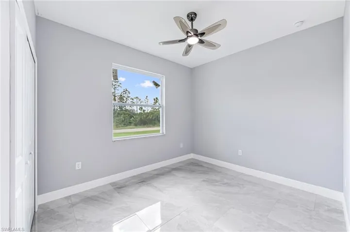 Spare room featuring ceiling fan