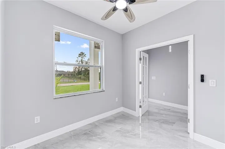 Empty room featuring ceiling fan