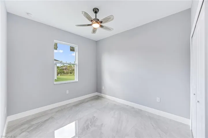 Empty room featuring ceiling fan