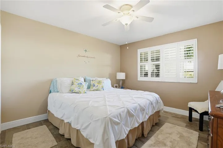 Bedroom featuring ceiling fan and wood finished floors