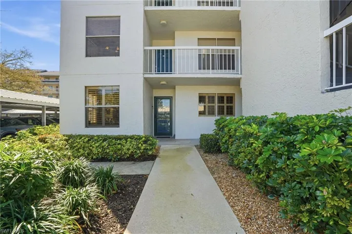 View of exterior entry with stucco siding