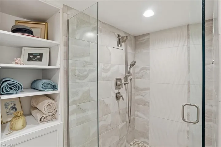 Bathroom featuring a stall shower and recessed lighting