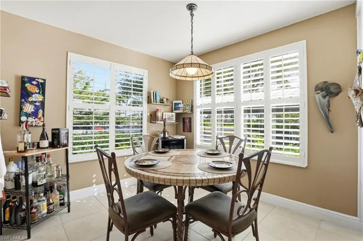 Dining area featuring light tile patterned flooring