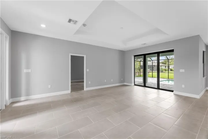 tray ceiling and light tile floors
