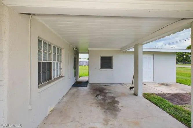 View of patio / terrace with an attached carport