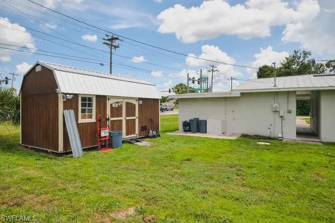 View of green lawn with a shed