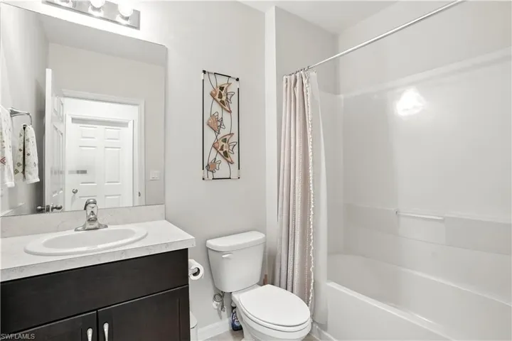 Full bathroom with vanity and shower / bathtub combo