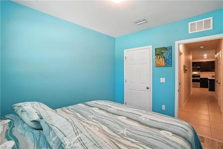 Bedroom with hallway to guest bathroom