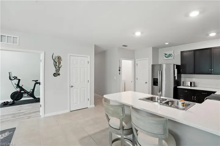 Kitchen with stainless appliances and pantry