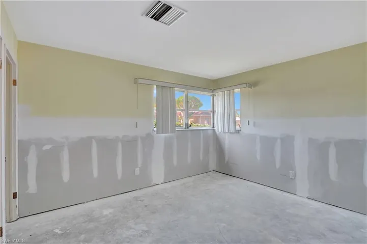 Spare room featuring concrete flooring