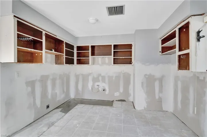 Misc room with light tile flooring