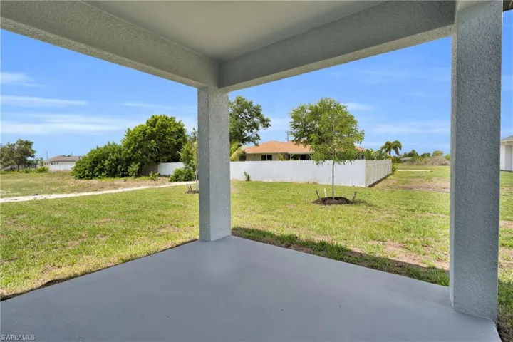 Covered patio with a smooth concrete surface and textured columns