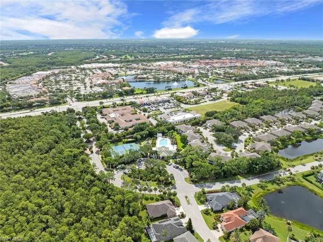 Aerial overview of property's location with nearby suburban area and a nearby body of water