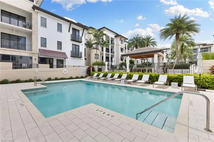 Community pool with a patio area
