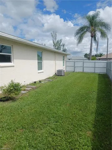 View of fenced backyard