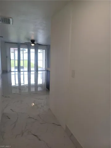 Hallway with light marble finish flooring