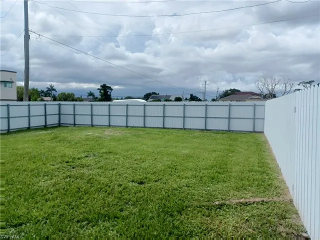 View of fenced backyard