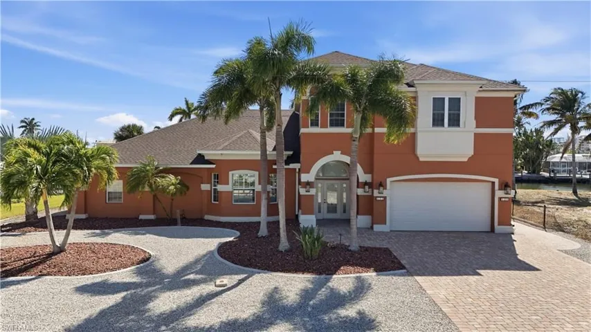 Mediterranean / spanish home featuring curved driveway, stucco siding, roof with shingles, and a garage - Virtually Edited Image