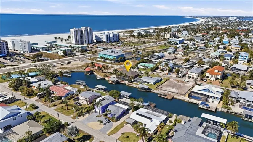 Aerial overview of property's location with a large body of water - Virtually Edited Image