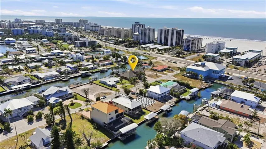 View of property location with a large body of water and nearby urban area - Virtually Edited Image