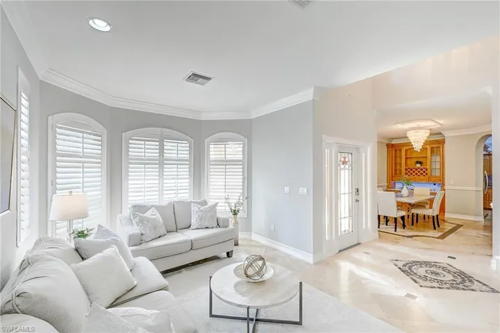 Entry Foyer and formal dining with built in bar & wine rack