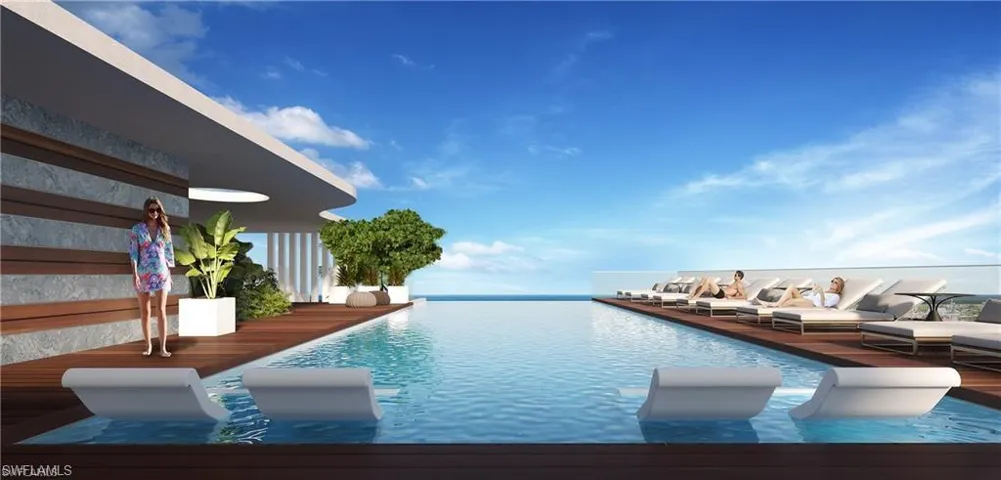 View of swimming pool featuring an infinity pool and a rooftop deck