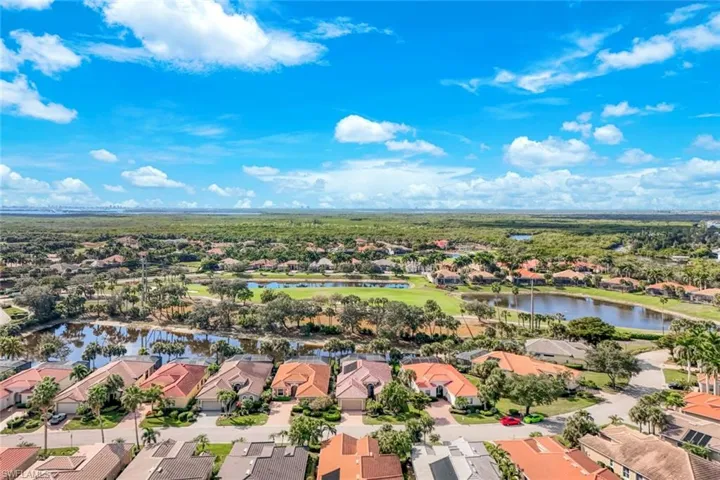 Aerial view of residential area with a nearby body of water