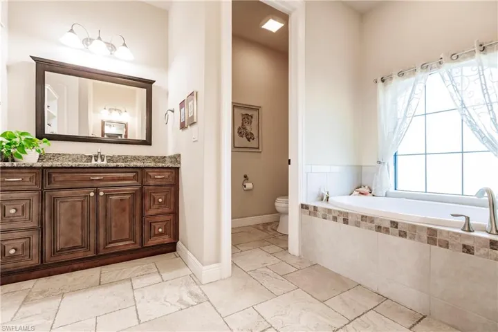 EnSuite with Jacuzzi Tub and Her Vanity!