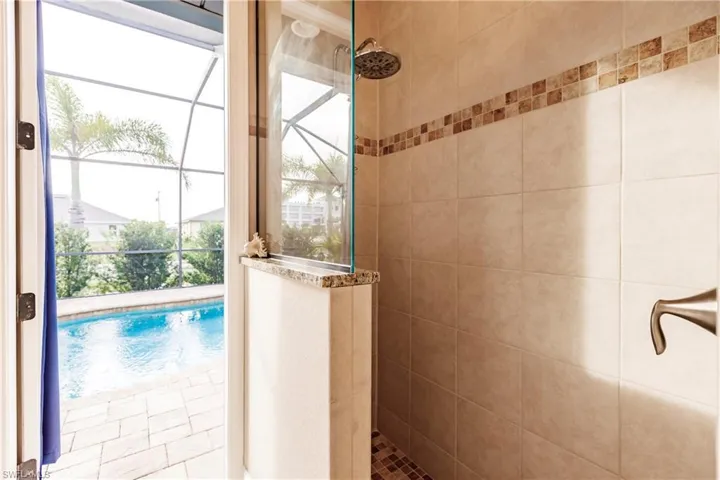 Pool Bath with Walk-In Shower leading to the Pool Area!