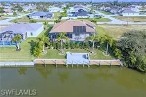 Aerial of Rear of Home, Canal & Dock