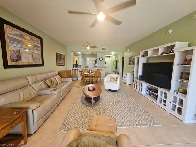 Living area featuring light tile patterned floors