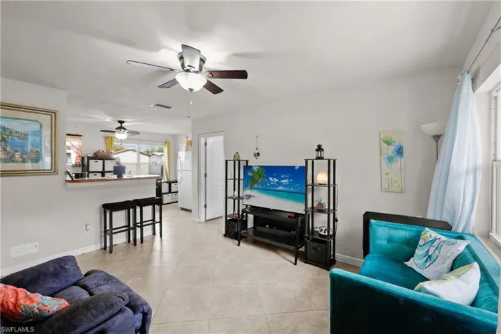 Living room into kitchen with master bedroom to the right