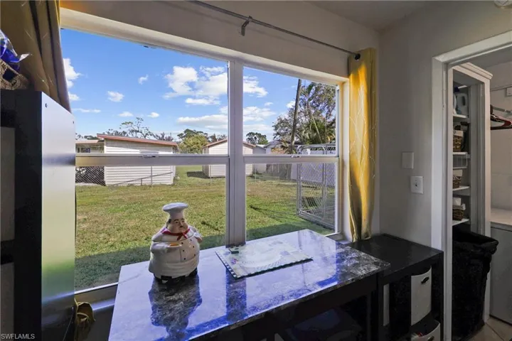 Nice big window for view of the fenced backyard - dog run area seen to the right in the back yard