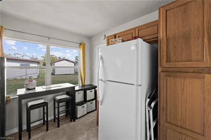 Laundry and pantry just past the fridge!