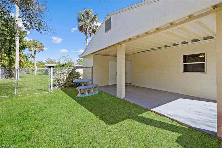 Carport and fenced yard - key to lock up the storage